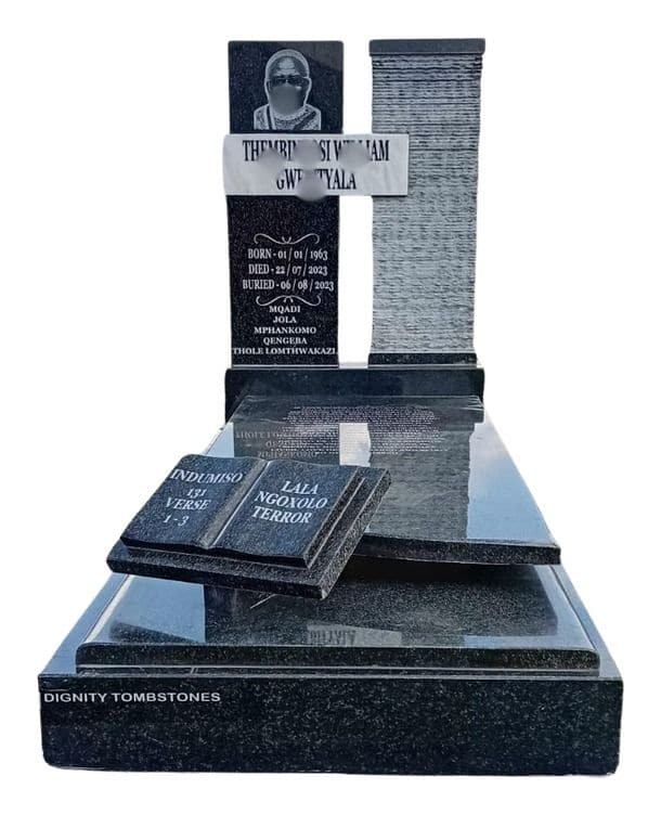 MAX 11 tombstone: cross headstone with an open granite book on a wide slab