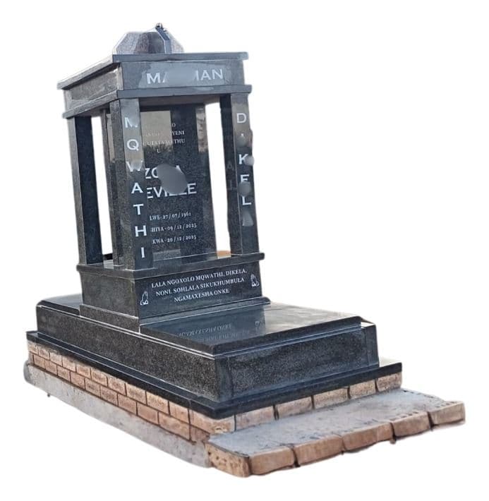 MAX 14 tombstone: pillared gazebo headstone on a brick-edged base