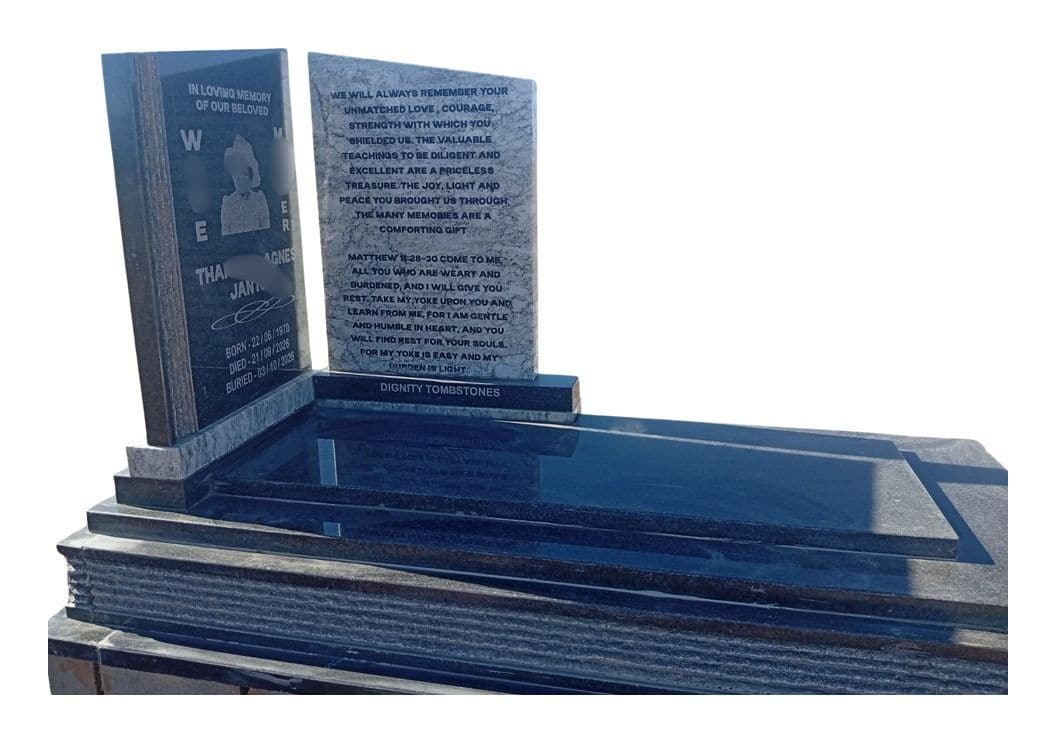 MAX 15 tombstone: twin open-book panels on a stepped black granite slab